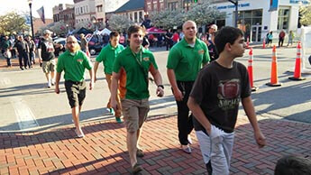 The H.U.N.K.S. participating in the "Walk a Mile In Her Shoes" fundraising march
