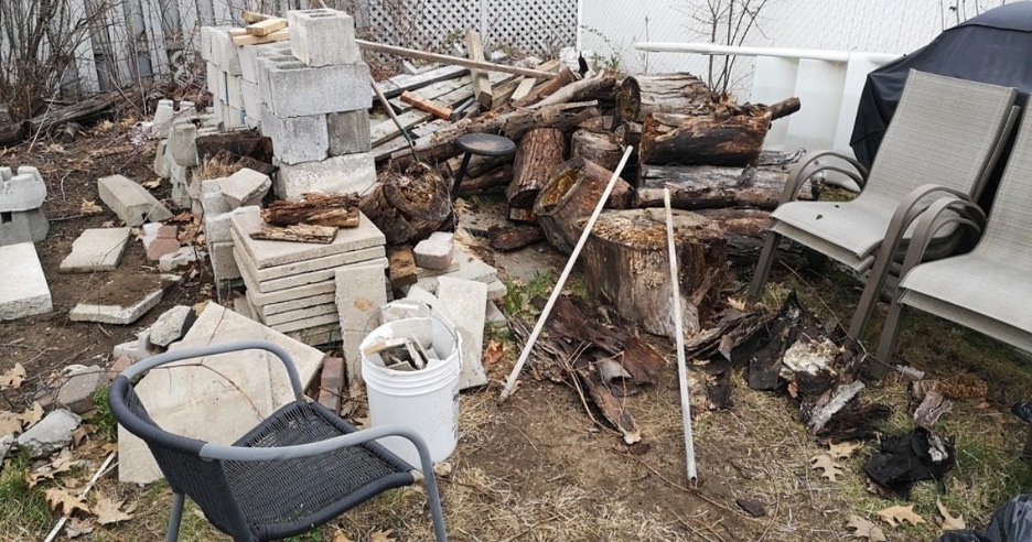 Piles of junk and debris outside of a Raleigh home