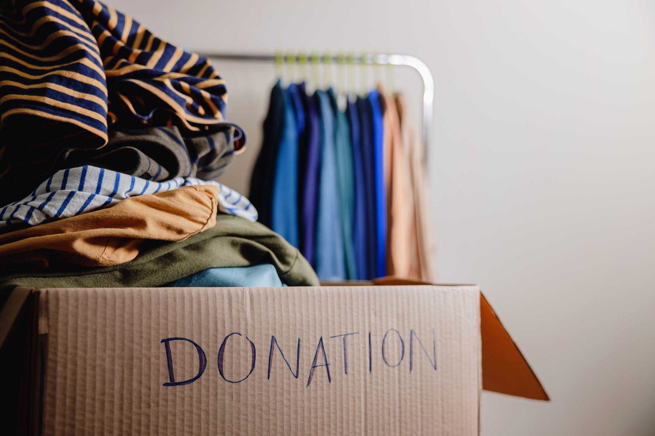 Donation box filled with gently used clothes, toys, and linens